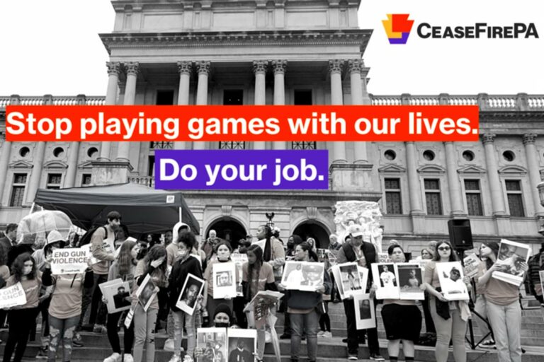 Gun sense protesters in front of the capitol with the words Stop Playing Games With Our Lives: Do your job